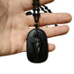 Halskette mit Perlenanhänger in Form einer religiösen Figur